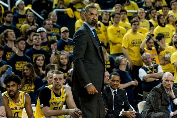 David DeJulius (0), Austin Davis (51), Juwan Howard, Howard Eisley, and Phil Martelli