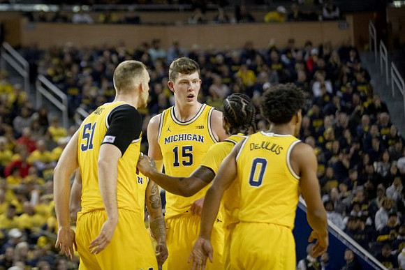 Austin Davis (51), Jon Teske (15), Zavier Simpson (3), and David DeJulius (0)