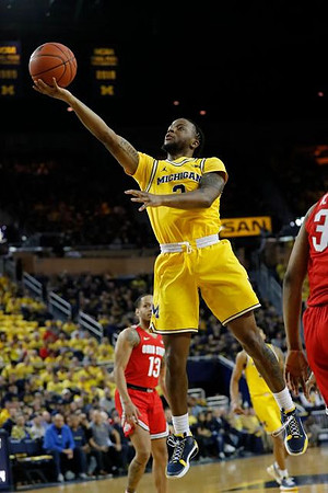 Zavier Simpson (3) and Eli Brooks (55)