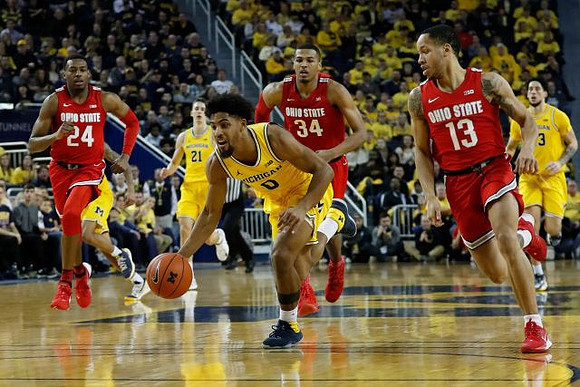 Franz Wagner (21), David DeJulius (0), and Brandon Johns Jr. (23)