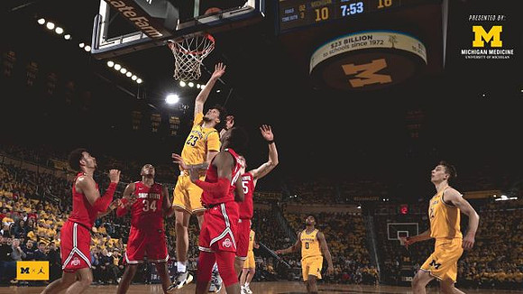Brandon Johns Jr. (23), David DeJulius (0), and Franz Wagner (21)