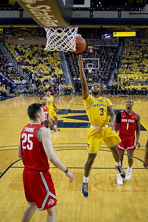 Eli Brooks (55) and Zavier Simpson (3)