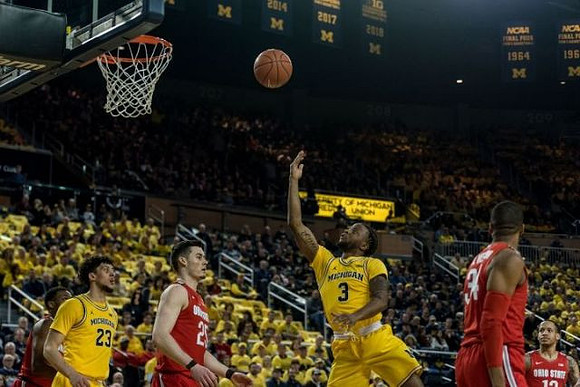 Brandon Johns Jr. (23) and Zavier Simpson (3)