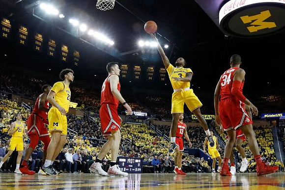 Zavier Simpson (3), Brandon Johns Jr. (23), Franz Wagner (21), and Eli Brooks (55)
