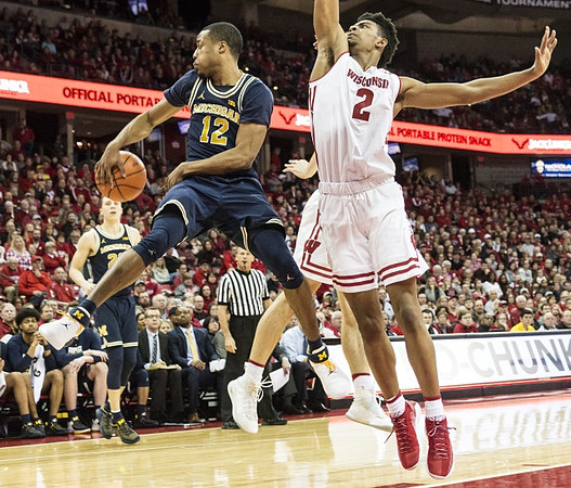 Muhammad-Ali Abdur-Rahkman (12) and Duncan Robinson (22)