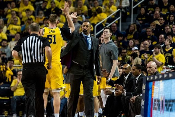 Austin Davis (51), Juwan Howard, Colin Castleton (11), Saddi Washington, Howard Eisley, and Phil Martelli