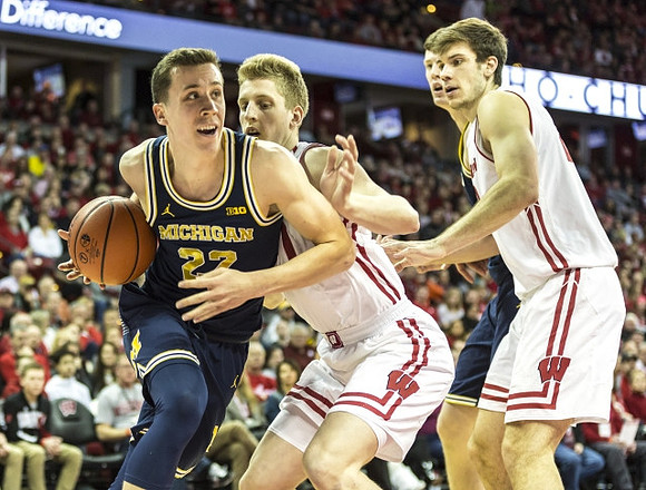 Duncan Robinson (22) and Jon Teske (15)