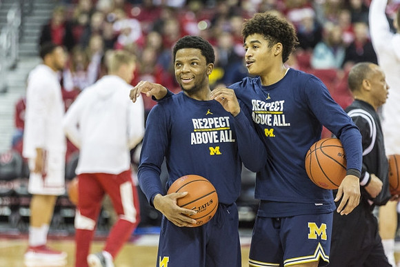 Zavier Simpson (3) and Jordan Poole (2)