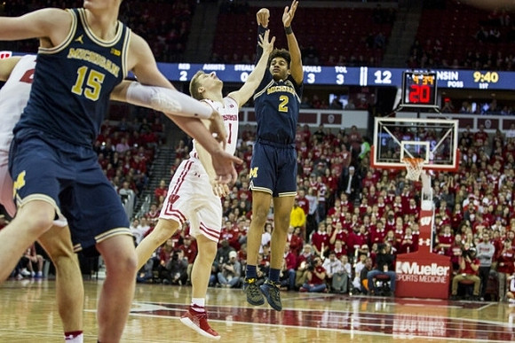 Jon Teske (15) and Jordan Poole (2)