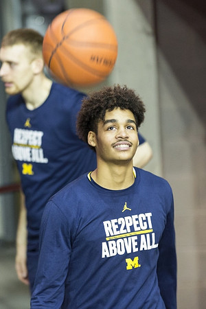 Jordan Poole (2) and Austin Davis (51)