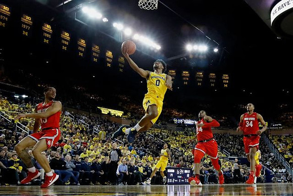 Zavier Simpson (3) and Eli Brooks (55)
