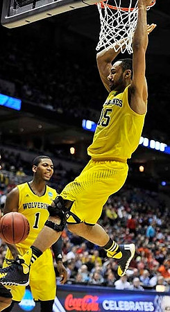 Glenn Robinson III (1) and Jon Horford (15)