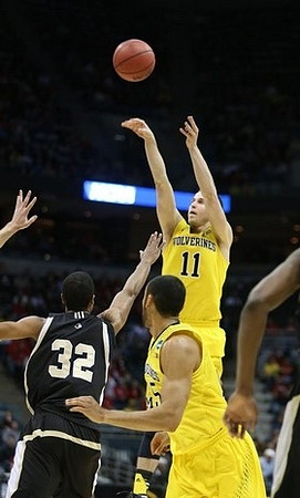Nik Stauskas (11) and Jon Horford (15)