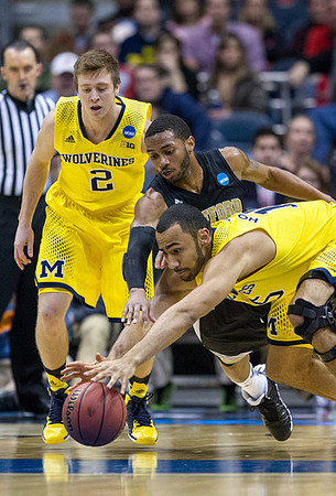 Spike Albrecht (2) and Jon Horford (15)
