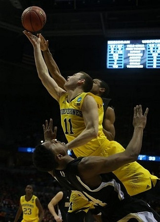 Nik Stauskas (11) and Caris LeVert (23)