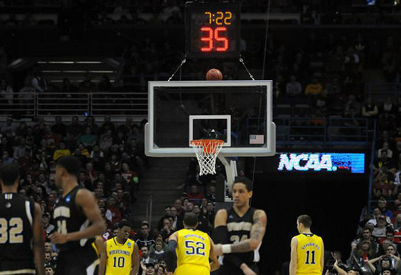 Derrick Walton Jr. (10), Jordan Morgan (52), and Nik Stauskas (11)
