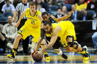 Spike Albrecht (2) and Jon Horford (15)