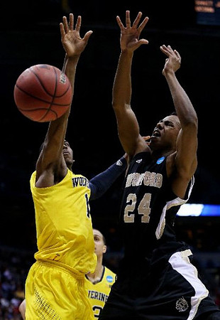 Glenn Robinson III (1) and Jordan Morgan (52)