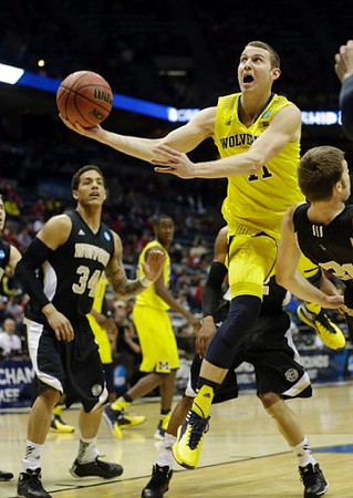 Nik Stauskas (11) and Caris LeVert (23)