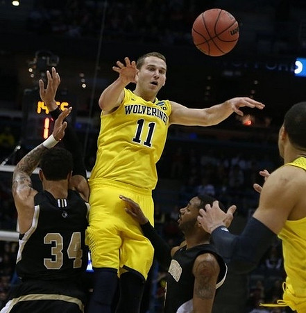 Nik Stauskas (11) and Jordan Morgan (52)