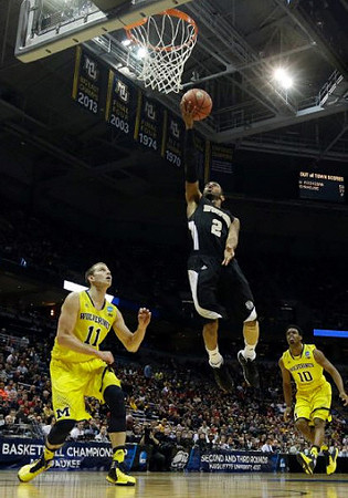 Nik Stauskas (11) and Derrick Walton Jr. (10)