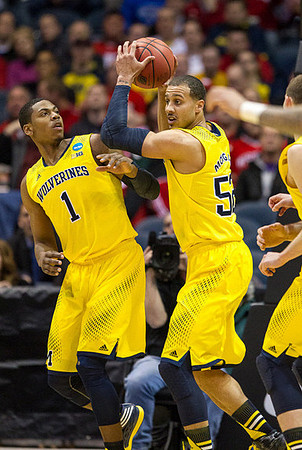 Glenn Robinson III (1) and Jordan Morgan (52)