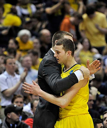 Nik Stauskas (11) and Mitch McGary (4)