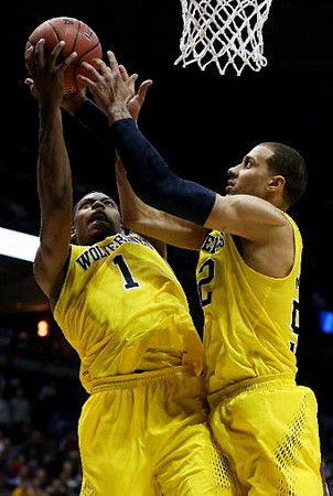 Glenn Robinson III (1) and Jordan Morgan (52)