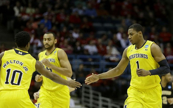 Derrick Walton Jr. (10), Jon Horford (15), and Glenn Robinson III (1)