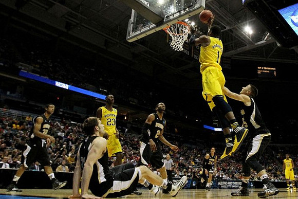 Caris LeVert (23), Glenn Robinson III (1), and Derrick Walton Jr. (10)