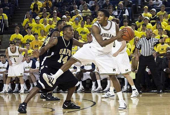 Stu Douglass (1), Darius Morris (4), and Zack Novak (0)