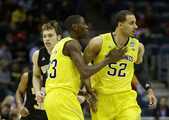 Caris LeVert (23) and Jordan Morgan (52)