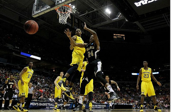 Derrick Walton Jr. (10), Nik Stauskas (11), Glenn Robinson III (1), and Caris LeVert (23)