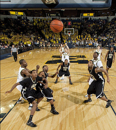 Zack Novak (0), DeShawn Sims (34), Manny Harris (3), Stu Douglass (1), and Darius Morris (4)