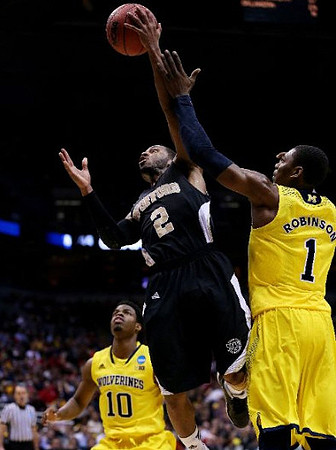 Derrick Walton Jr. (10) and Glenn Robinson III (1)