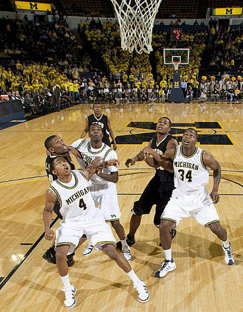 Darius Morris (4), Manny Harris (3), and DeShawn Sims (34)