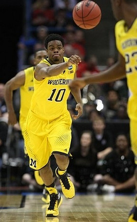 Glenn Robinson III (1), Derrick Walton Jr. (10), and Caris LeVert (23)