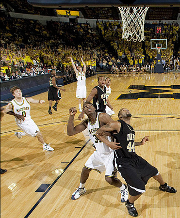 Zack Novak (0), Stu Douglass (1), DeShawn Sims (34), and Darius Morris (4)