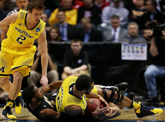 Spike Albrecht (2) and Jon Horford (15)