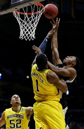 Glenn Robinson III (1) and Jordan Morgan (52)