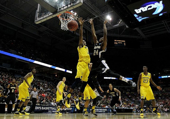 Derrick Walton Jr. (10), Nik Stauskas (11), Glenn Robinson III (1), and Caris LeVert (23)