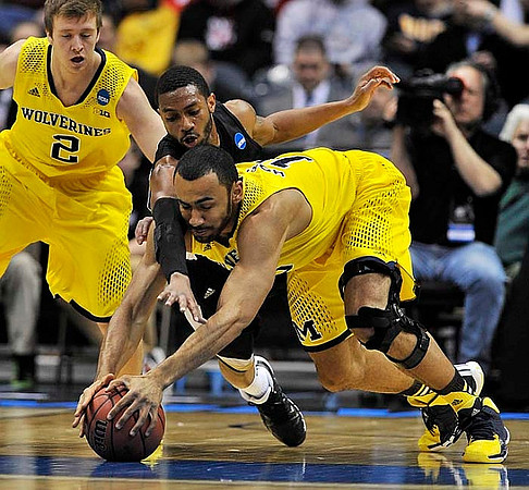 Spike Albrecht (2) and Jon Horford (15)