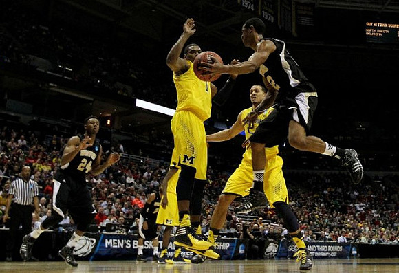 Glenn Robinson III (1) and Jordan Morgan (52)