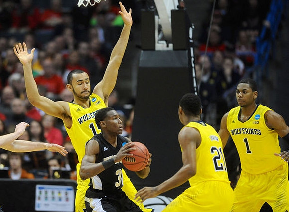 Jon Horford (15), Zak Irvin (21), and Glenn Robinson III (1)