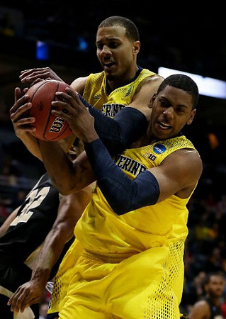 Jordan Morgan (52) and Glenn Robinson III (1)