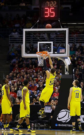 Caris LeVert (23), Derrick Walton Jr. (10), Jordan Morgan (52), and Nik Stauskas (11)