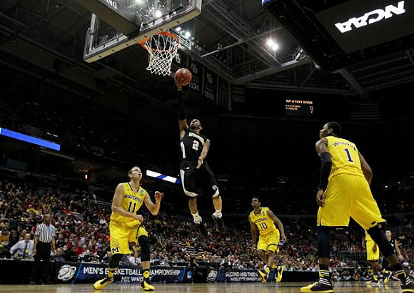 Nik Stauskas (11), Derrick Walton Jr. (10), and Glenn Robinson III (1)