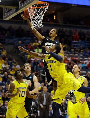 Derrick Walton Jr. (10), Glenn Robinson III (1), and Jordan Morgan (52)