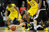 Derrick Walton Jr. (10) and Caris LeVert (23)