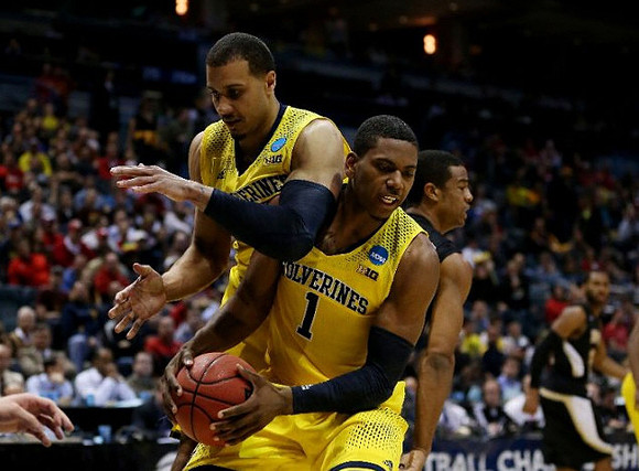Jordan Morgan (52) and Glenn Robinson III (1)